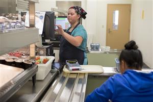 cafe manager entering charges 